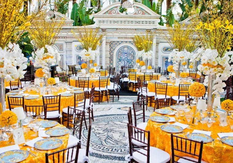 A dinner setup with an orange and white color scheme